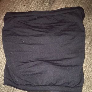 A Black Great Expectations crop top with no straps .